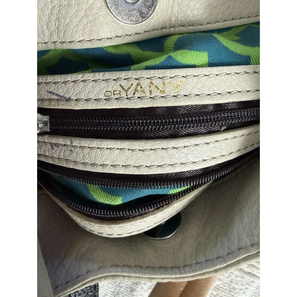OrYANY Beige leather bag orange accents and a black strap Crossbody